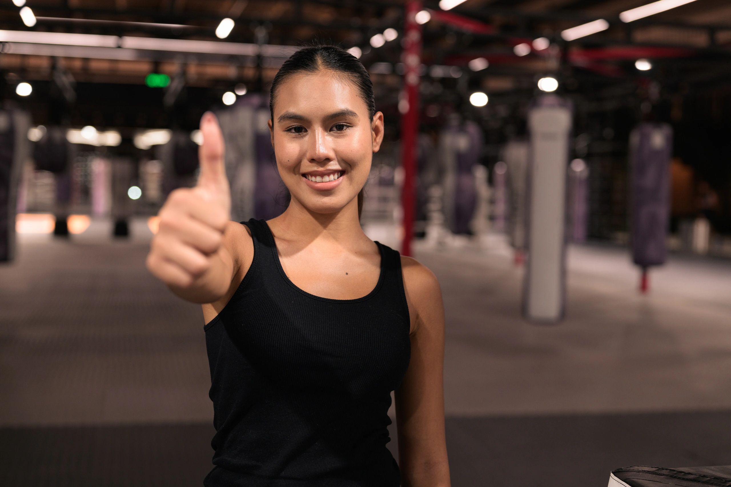 Confident wellness professional smiling in an active setting